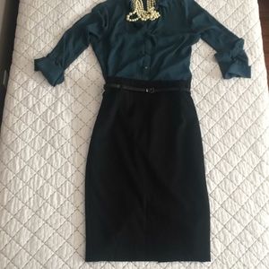 High-waisted, black pencil skirt. Hits below knee.